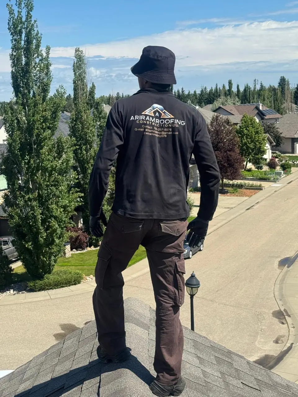 Ariram Roofing team member on a residential roof in Edmonton